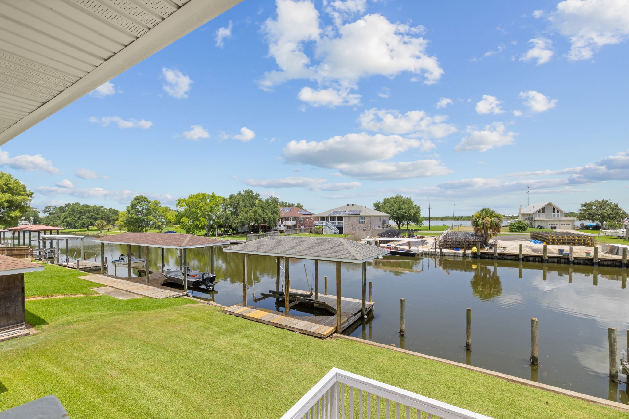 Canal frontage with neighboring boathouses