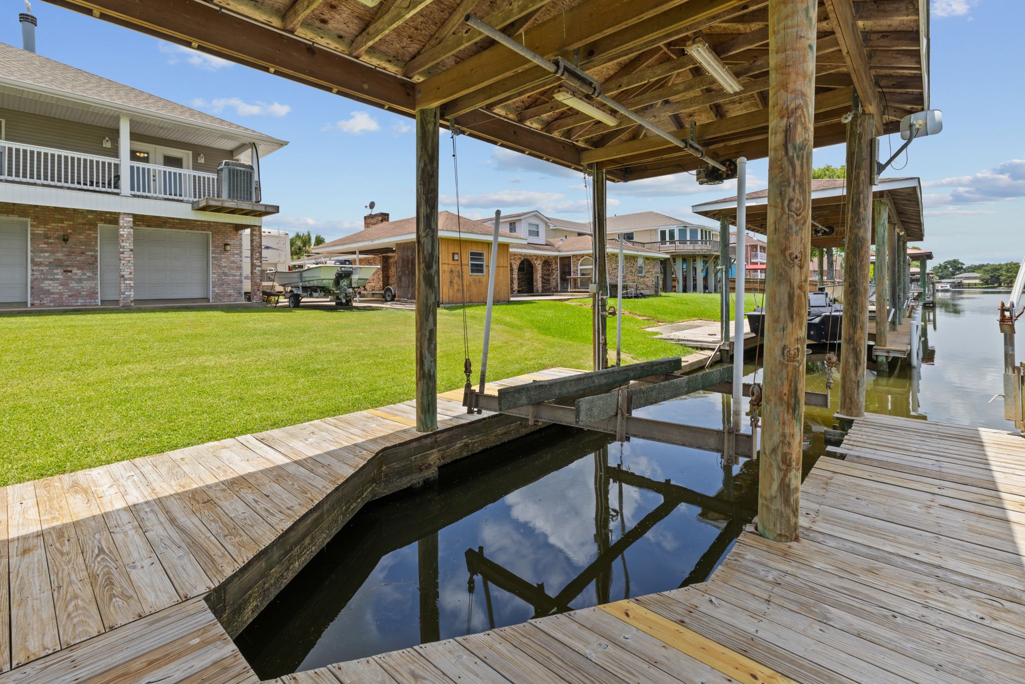 Covered boat slip beneath the San Marco house