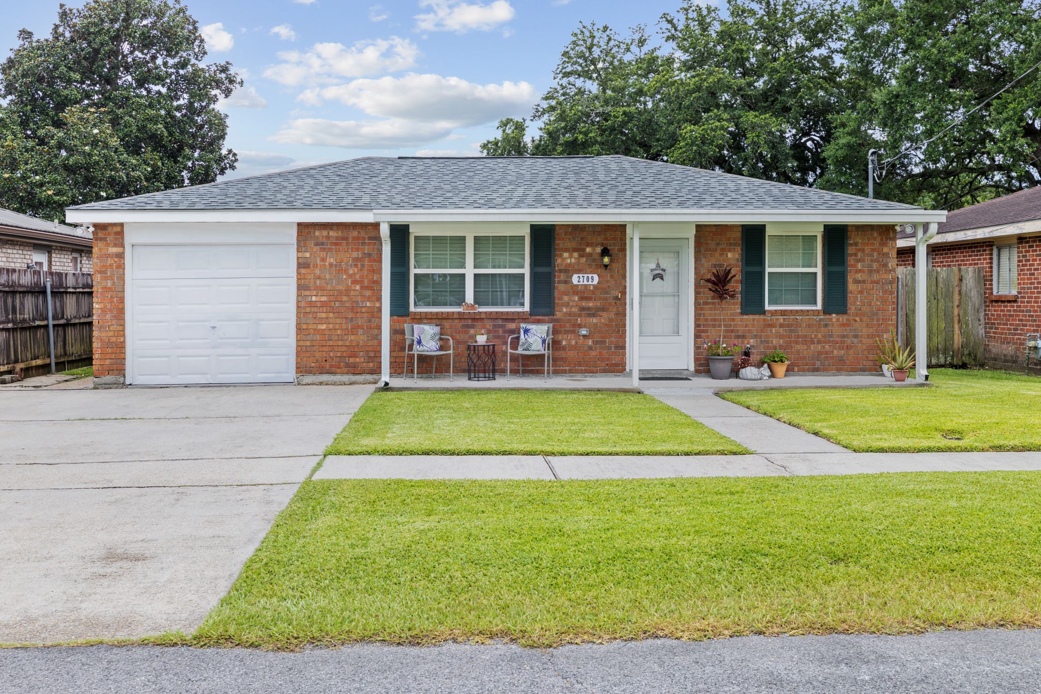 Brick ranch home with a covered front porch